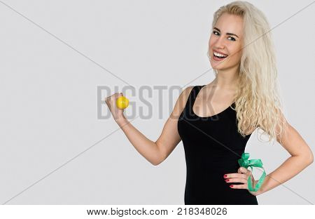 Slender Woman Smiling and Holding Dumbbells Isolated on White Background. Copy Space