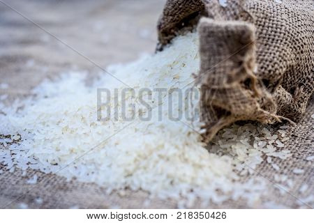 Raw Organic Rice,oryza Sativa, Coming Out From A Gunny Bag.