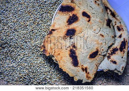 Roti/chapati Of Pearl Millet/bajra/pennisetum Glaucum With Whole Grains Of Pearl Millet.