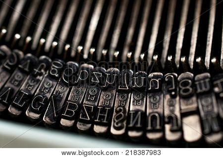 Numbers and letters on an old type writer machine macro shot