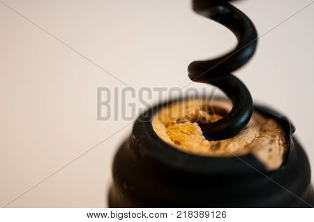Opening a bottle of vine with the corkscrew
