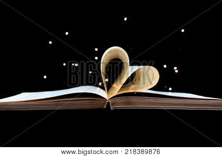 Love of book conceptual image on black background