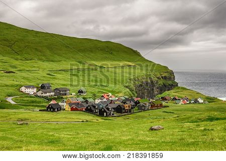 Picturesque village of Gjogv with typically colourful houses on the island of Eysturoy, Faroe Islands, Denmark