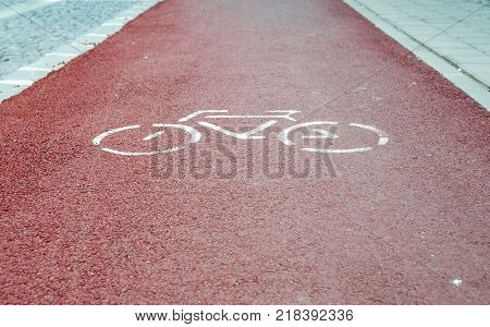 Red bycicle path in a small European town