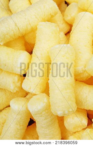 Cheese puff. Cheese puffs snack background texture food pattern. Food photo.