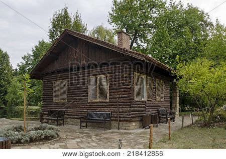 Wooden house  in National monument of landscape architecture Park museum Vrana in former time royal palace on the outskirts of Sofia, Bulgaria, Europe