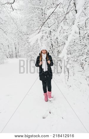 Beautiful Young Girl In A White Winter Forest