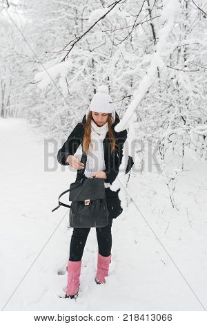Beautiful Young Girl In A White Winter Forest