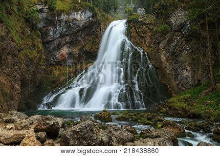 Beautiful Golling waterfall and near Golling and Salzach medieval town at autumn in Austria