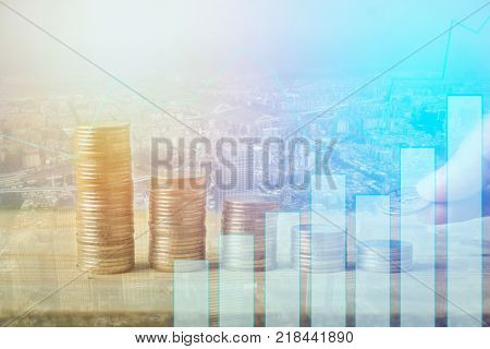 Finance, capital banking and investment concept, Double exporsure stacked of coins and night city with graph