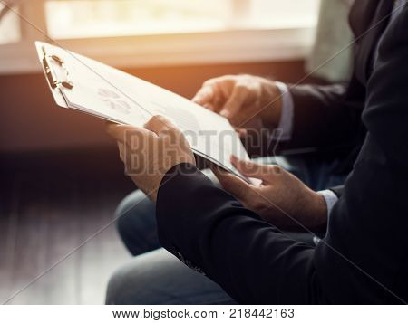 businessman present and talking with parthner and admire in meeting room mixed media