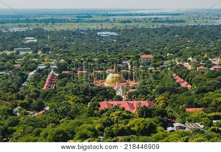 High angle view of multiple temples and pagodas on the mountains with Irrawaddy river in the background from sagaing hill, Sagaing region of Myanmar.