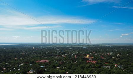 High angle view of multiple temples and pagodas on the mountains with Irrawaddy river in the background from sagaing hill, Sagaing region of Myanmar.
