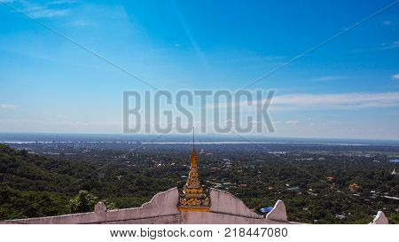 High angle view of multiple temples and pagodas on the mountains with Irrawaddy river in the background from sagaing hill, Sagaing region of Myanmar