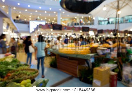 Blur background of flea market in shopping mall Life style of people walking at floating market with beautiful bokeh
