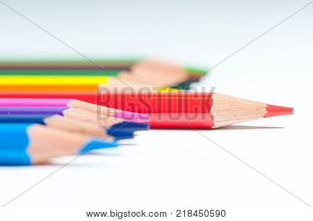 Colorful pencils close up shot, the red pencil in front, leadership conceptual image.
