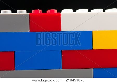 Colorful play construction bricks close up shot.