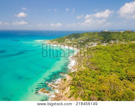 An aerial view of Byron Bay on a clear day with blue water