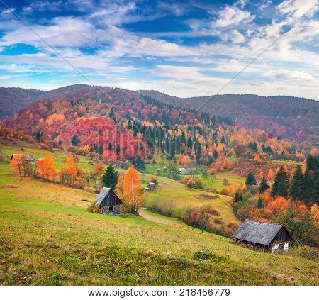Colorful rural scene in the Kvasy village Transcarpathian Ukraine Europe. Beautiful autumn landscape in the mountains. Artistic style post processed photo.