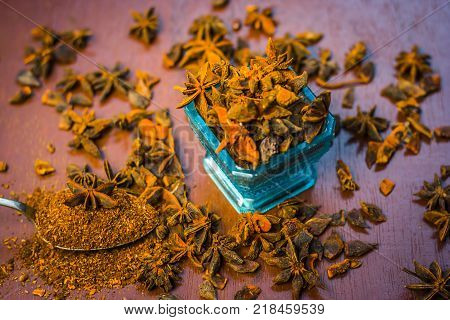 Close Up Star Aniseed,illicium Verum In A Bowl With Powder.