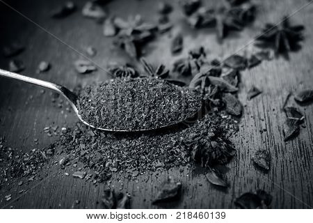 Close Up Star Aniseed,illicium Verum Powder In A Antique Spoon.
