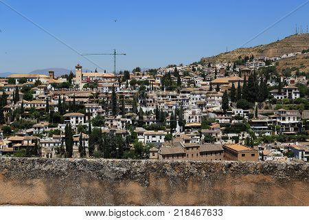 GRANADA, SPAIN - MAY 20, 2017: Albaicin is a residential district the architecture and planning of which are inherited from the Muslim period of medieval Spain.