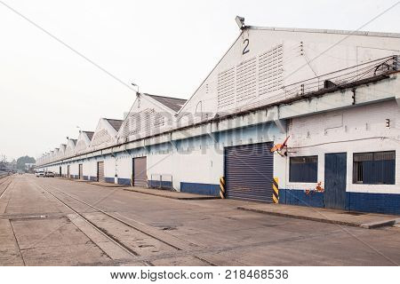 Perspective of White Warehouse Godown to Stocks the Wood