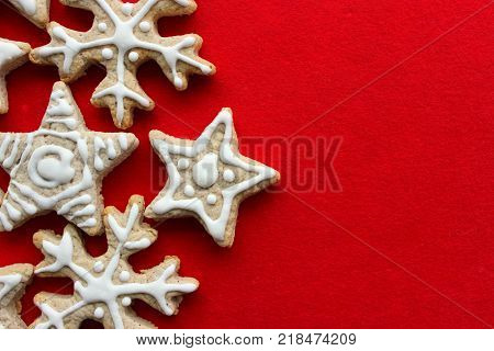 Christmas pastries the gingerbread cookie in the shape of stars and snowflakes food isolated on red background