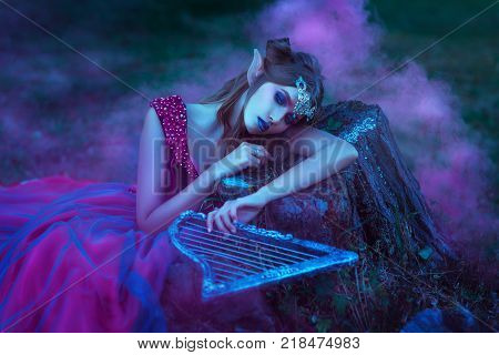 Elf woman in purple dress with harp in hands