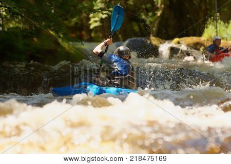 Frongoch Wales UK - June 18 2017: White water kayaker shooting the rapids at the National White Water Centre on the River Tryweryn in Snowdonia National Park