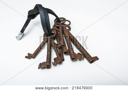 Macro old forged keys on white background