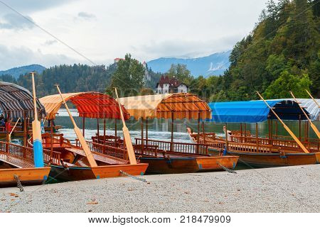 Lake Bled and traditional wooden Pletna at autumn in Slovenia