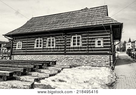 Folk architecture in Zdiar village Belianske Tatry mountains Slovak republic. Old painted building. Travel destination. Black and white photo.