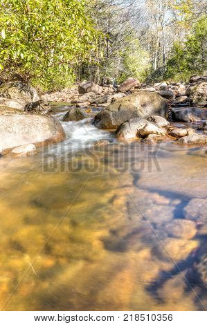 Williams River In Autumn With Stones, Bridge And Highland Scenic Highway Road In West Virginia Monon