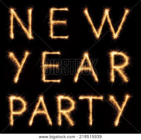 NEW YEAR PARTY lettering drawn with bengali sparkles isolated on black background