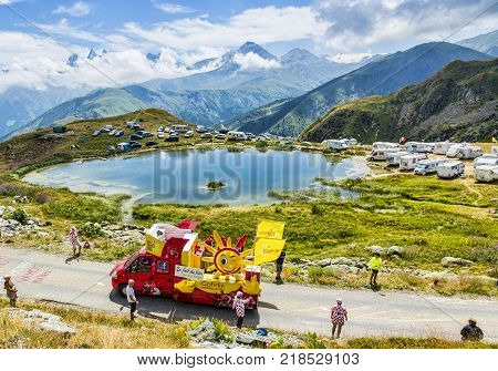 Col de la Croix de Fer France - 25 July 2015: Cofidis caravan driving on the road to the Col de la Croix de Fer in Alps during the stage 20 of Le Tour de France 2015. Cofidis in an important French money landing company.