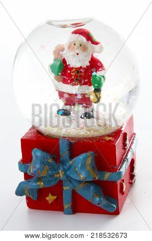 Waterglobe. Christmas waterglobe with Santa Claus. Christmas decoration glass ball water ball globe with snow and Santa Claus. Christmas decoration on white background.