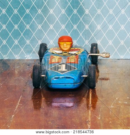 rerto racing car on old wooden floor with reflection