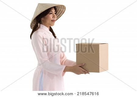 beautiful woman in pink dress and vietnam hat holding box. isolated background with clipping path.
