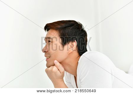 Men are playing mobile in the bedroom.