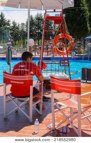 San Cesario Sul Panaro Modena Italy - July 16 2016: Lifeguard near sweeming pools of Piscina Barracuda