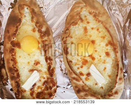 Adjarian khachapuri, open bread stuffed with cheese and egg yolk. Khachapuri is a traditional dish of Georgian cuisine.