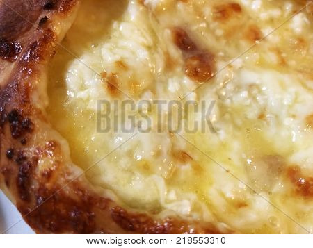 Adjarian khachapuri, open bread stuffed with cheese and egg yolk. Khachapuri is a traditional dish of Georgian cuisine.