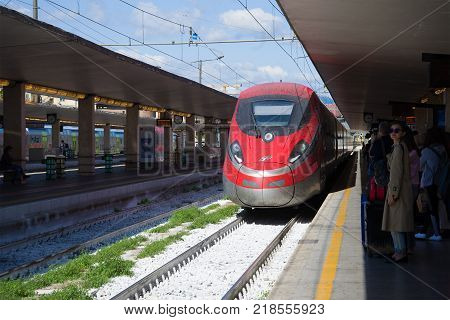 FLORENCE, ITALY - SEPTEMBER 25, 2017: Trenitalia high-speed train arrives on the central railway station