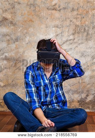 Troubled Young Man in Virtual Reality Glasses