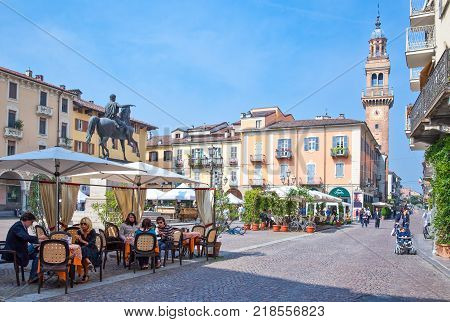 Casale Monferrato Italy - May 7 2011: People in an open air caffee bar in Piazza Mazzini