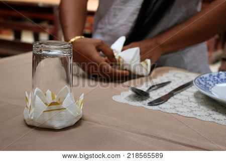 Asian women are practice folding the fabric nepkin.Thailand.