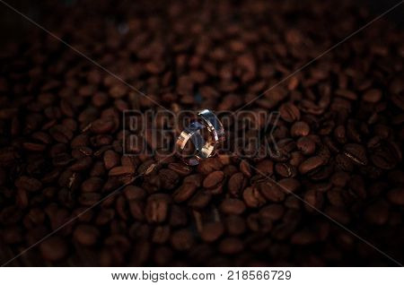 Wedding Rings Lying On The Coffee Beans
