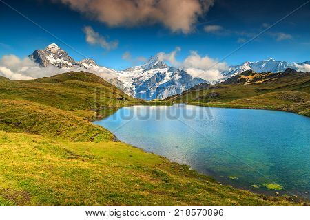 Bachalpsee alpine lake with high mountains and snowy peaks in background, Grindelwald, Bernese Oberland, Switzerland, Europe