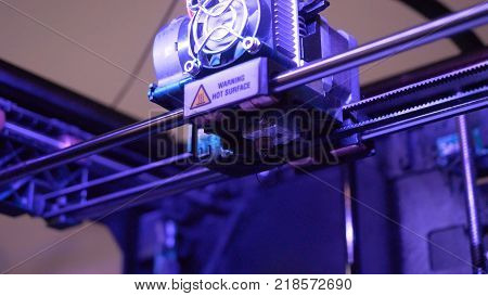Close-up Of 3d Printer Working. Head Of 3d Printer In Action. 3d Printer Is A New Generation Of Tech